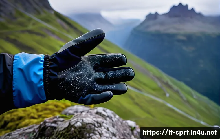 트레킹용 장갑 방수성 테스트 - A detailed close-up of high-performance waterproof trekking gloves made from Gore-Tex fabric, showca...